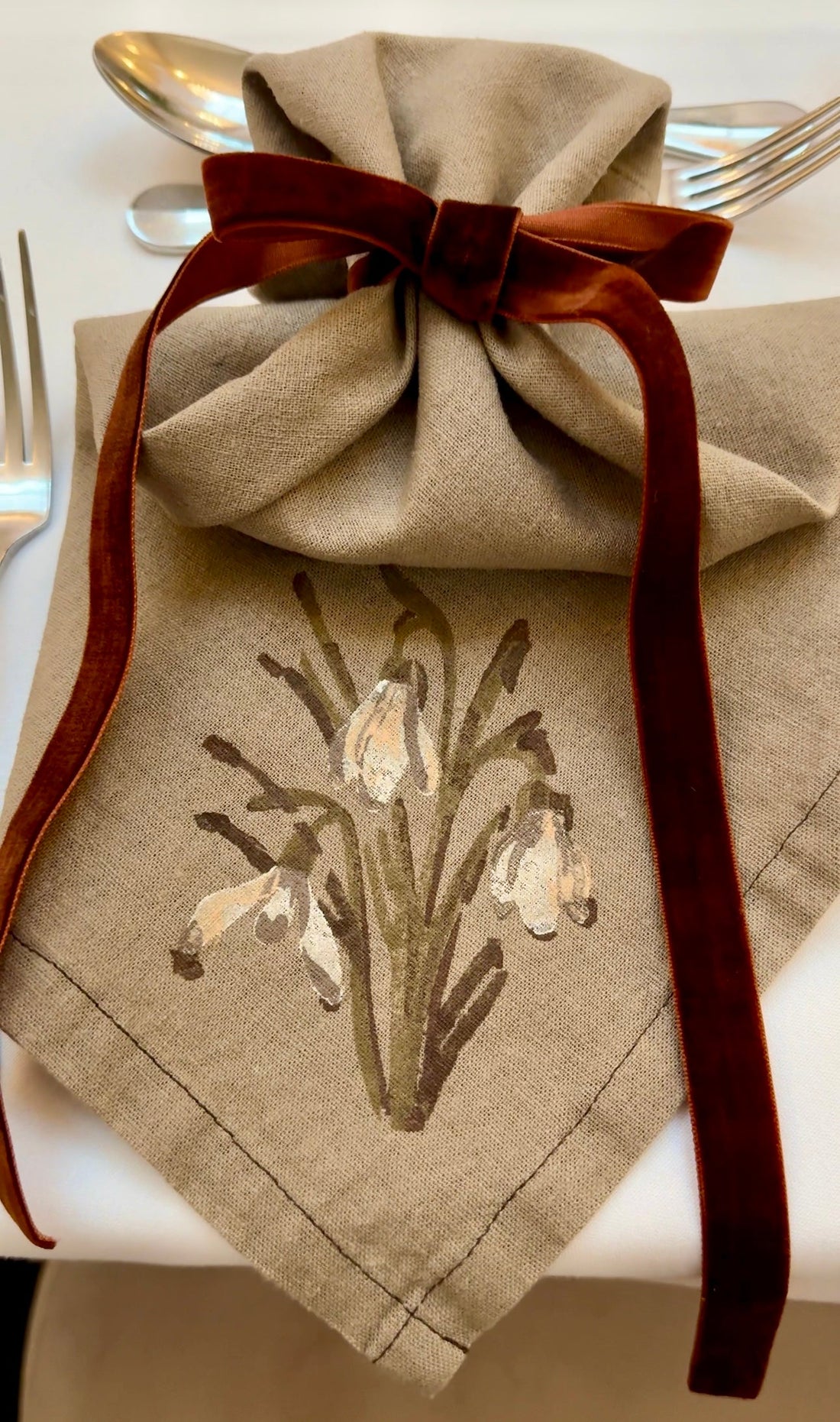 Bespoke Napkins for a Luxury Wedding Showcase Event: Snowdrops on "Mocha" coloured linen napkins.