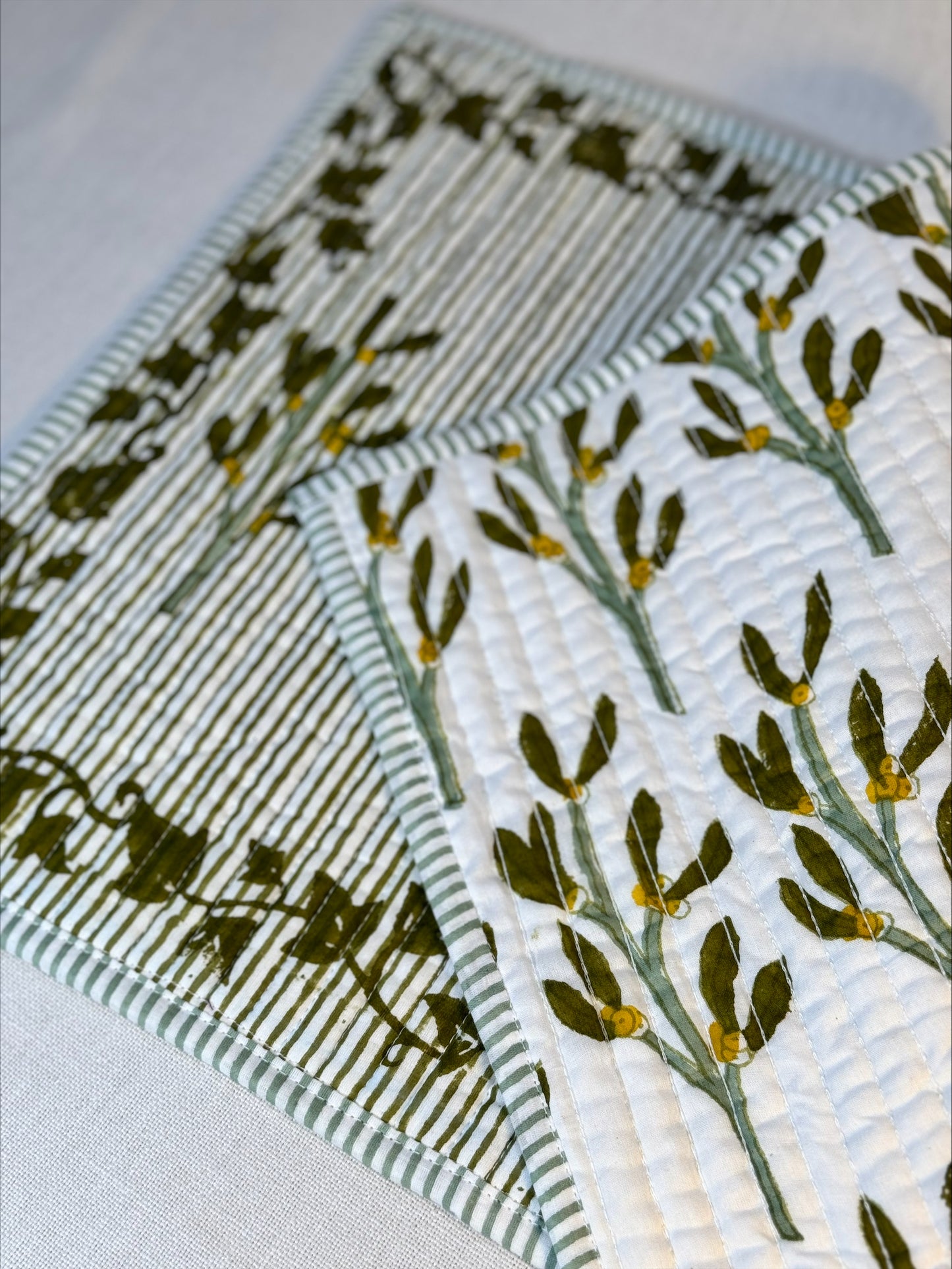 Hand block printed olive-green quilted, reversible placemats - set of 2