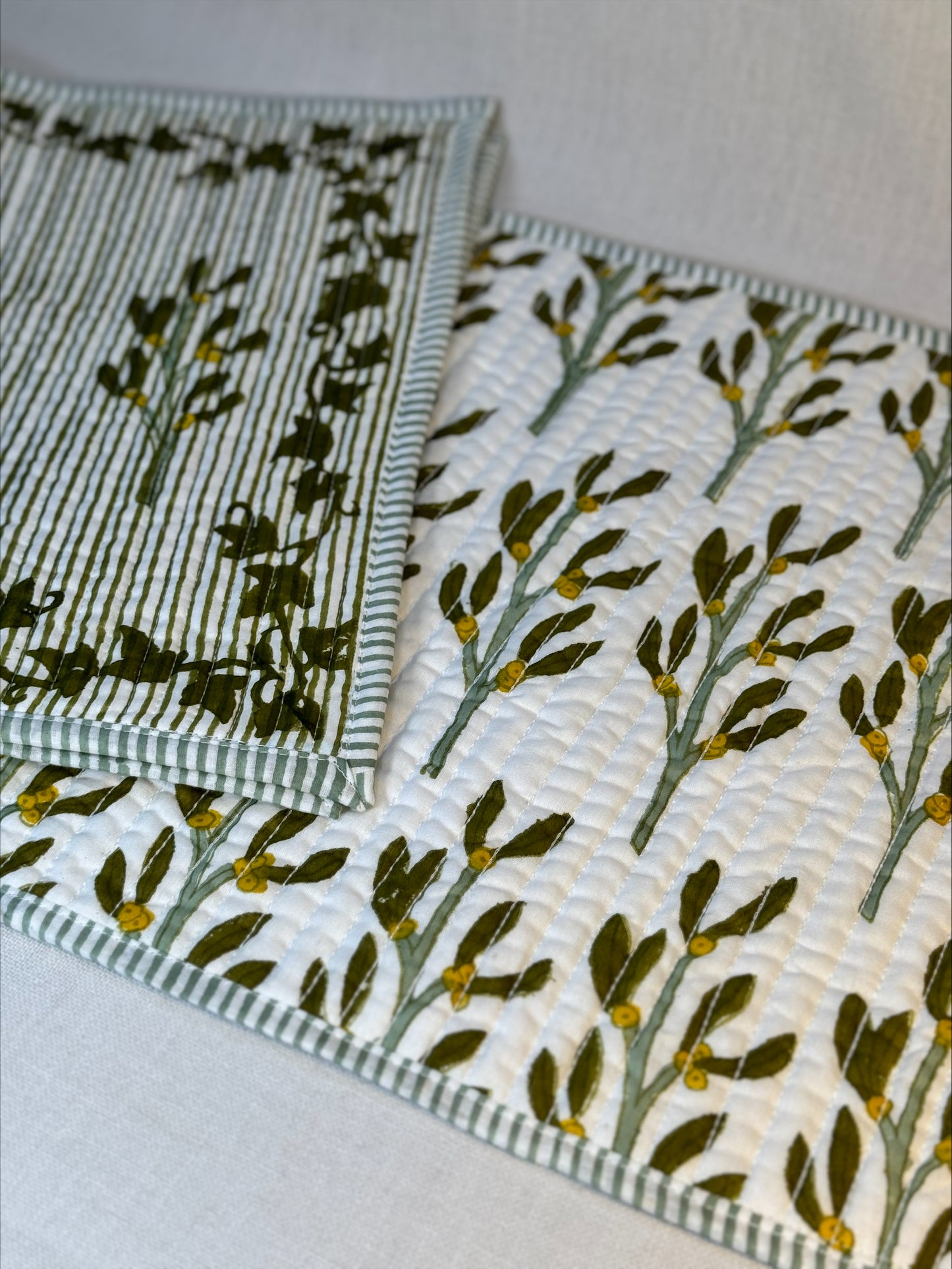 Hand block printed olive-green quilted, reversible placemats - set of 2